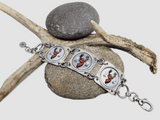 Rustic hunting-inspired bottle cap bracelet photographed with antlers and natural textures displayed over a deer antler and stones
