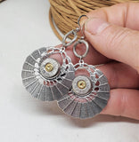 Antique Silver Round Basketweave 45 Auto Bullet Earrings shown in hand for scale