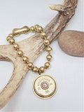 12 Gauge Shotshell Big Ball Chain Brass Charm Bracelet displayed on a deer antler.