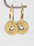 12 Gauge Shotshell Diamond Studded Gold Hoop Earrings hanging from wire