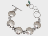 genuine buffalo nickel coin bracelet shown in the round on white background.