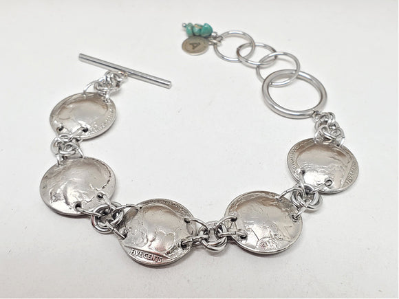 buffalo nickel coin link bracelet on white background