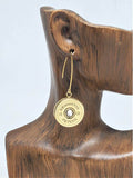 Single 12 gauge brass Remington-Peters shotshell earring with crystal center shown on display ear.