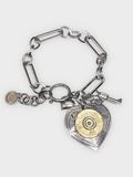 Paper clip chain style bracelet with heart and pistol charms and a focal heart pendant with a 20 gauge brass shotshell.  Bracelet is displayed on a white background.