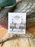 Goose band earrings displayed on SureShot Jewelry card with genuine aluminum bird bands, turquoise beads and stainless steel ear wires.  Earrings are leaning against a vintage duck decoy