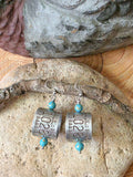 Lightweight goose band earrings with turquoise beads displayed on natural stone and wood, showing authentic numbered aluminum bird bands and stainless steel ear wires.