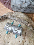 Lightweight goose band earrings with turquoise beads displayed on natural stone and wood, showing authentic numbered aluminum bird bands and stainless steel ear wires.