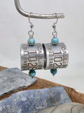 Pair of genuine goose band earrings with turquoise beads and stainless steel ear wires, photographed against a clean light background to show the curved aluminum bands.
