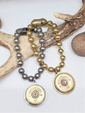 Two 12 Gauge Shotshell Big Ball Chain  Charm Bracelets displayed on a deer antler.  
